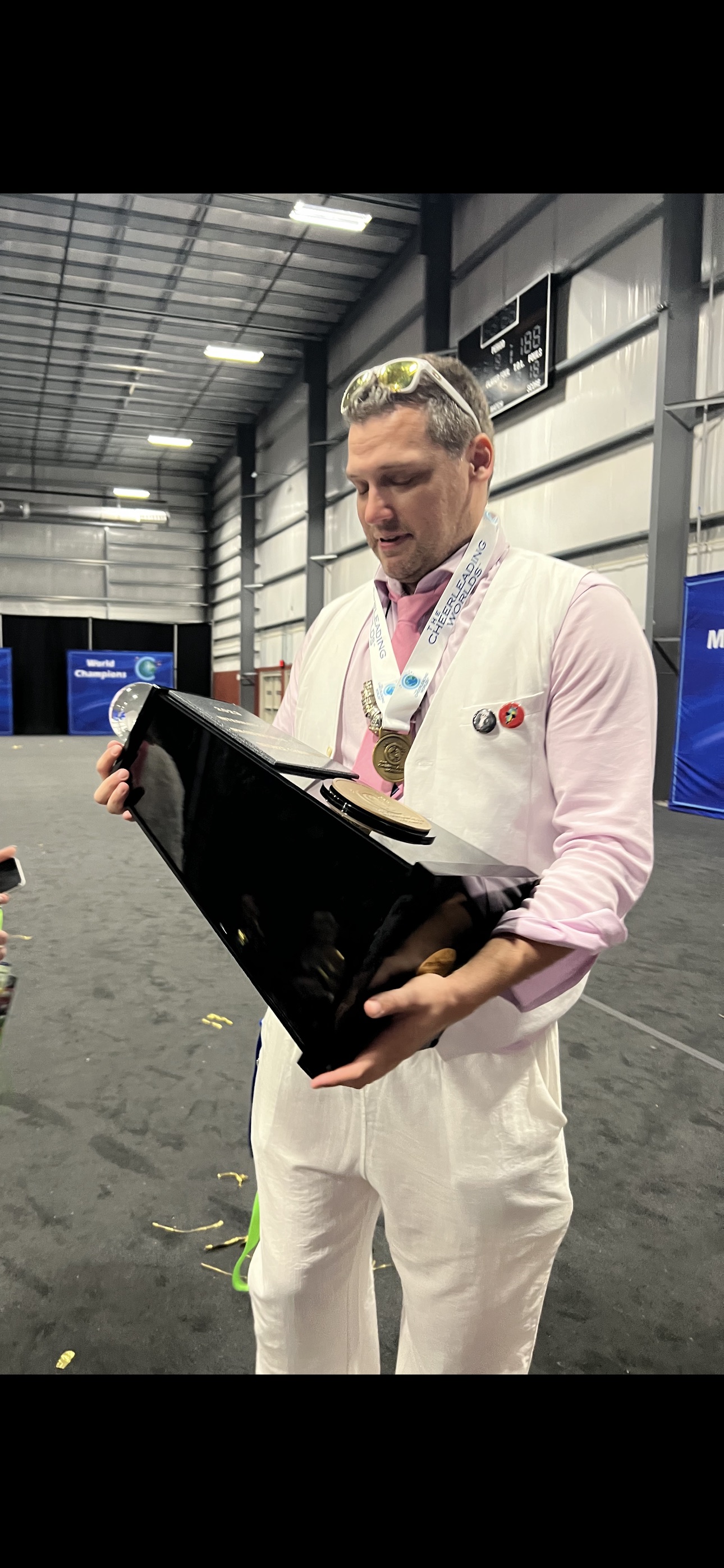 Charles looking at a Worlds trophy